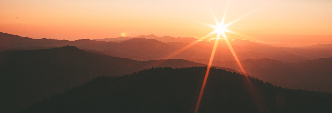 sun over a mountain