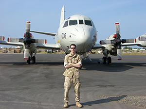 Rich Parella, HR Business Partner, in front of a P3 navy airplane